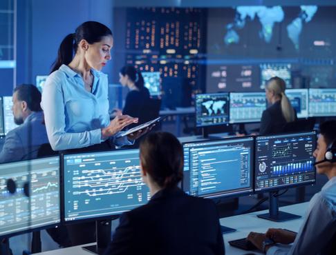 SOC analysts monitoring cybersecurity threats and performing digital forensic investigations during an enterprise incident response operation.